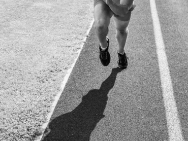 Runner take part competition motion forward. Focused on sport goal. Ready to achieve victory. Man athlete focused on running race. Runner athlete concentrated try his best. Effort to win sprint race